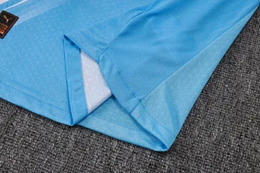 Image 11 de l’album Maillot à manches courtes et pantalon domicile Manchester City 25-26
